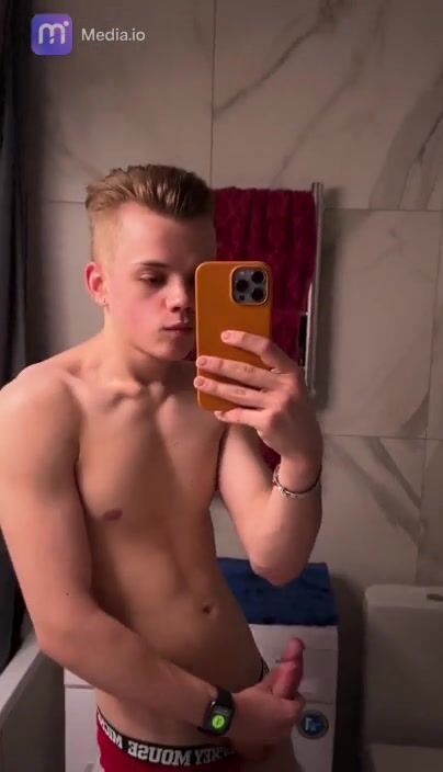 Cute 18 yo hunk strokes his cock to climax in bathroom