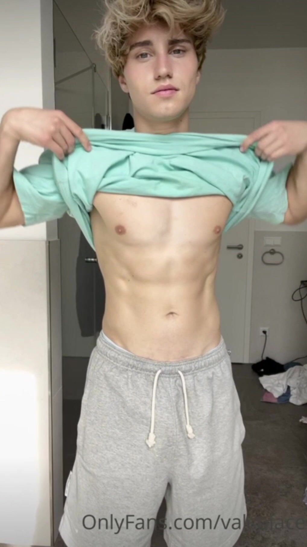 A blond guy masturbates and ejaculates