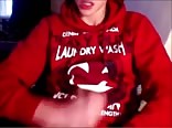 Handsome red sweater twink jerks off and swallows his load