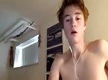 A handsome smooth boy masturbates in his room