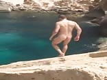 Nude straight boy takes a magnificent sea dip