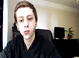 Tattooed boy strokes his hard cock