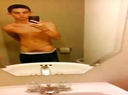 A twink strip naked, wanks and then cums.