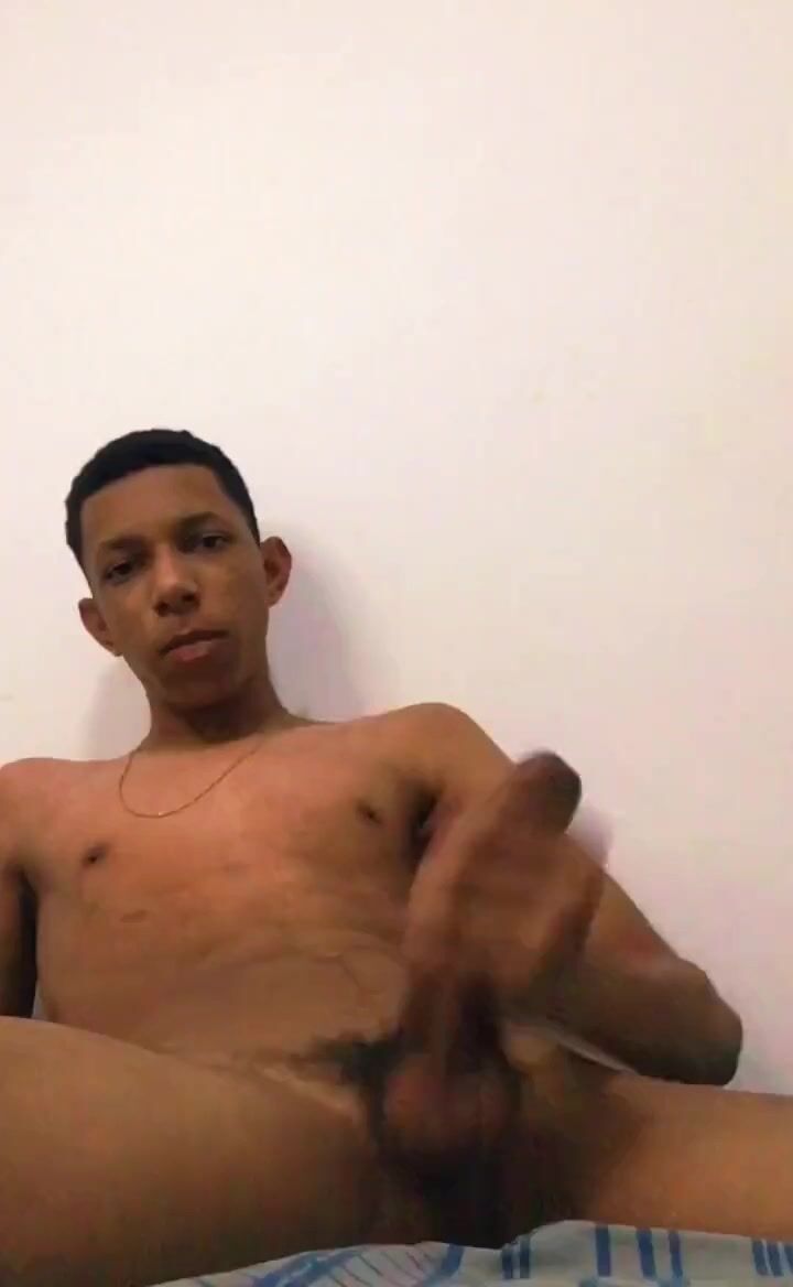 Latino twink wanking in bedroom with cute cumshot
