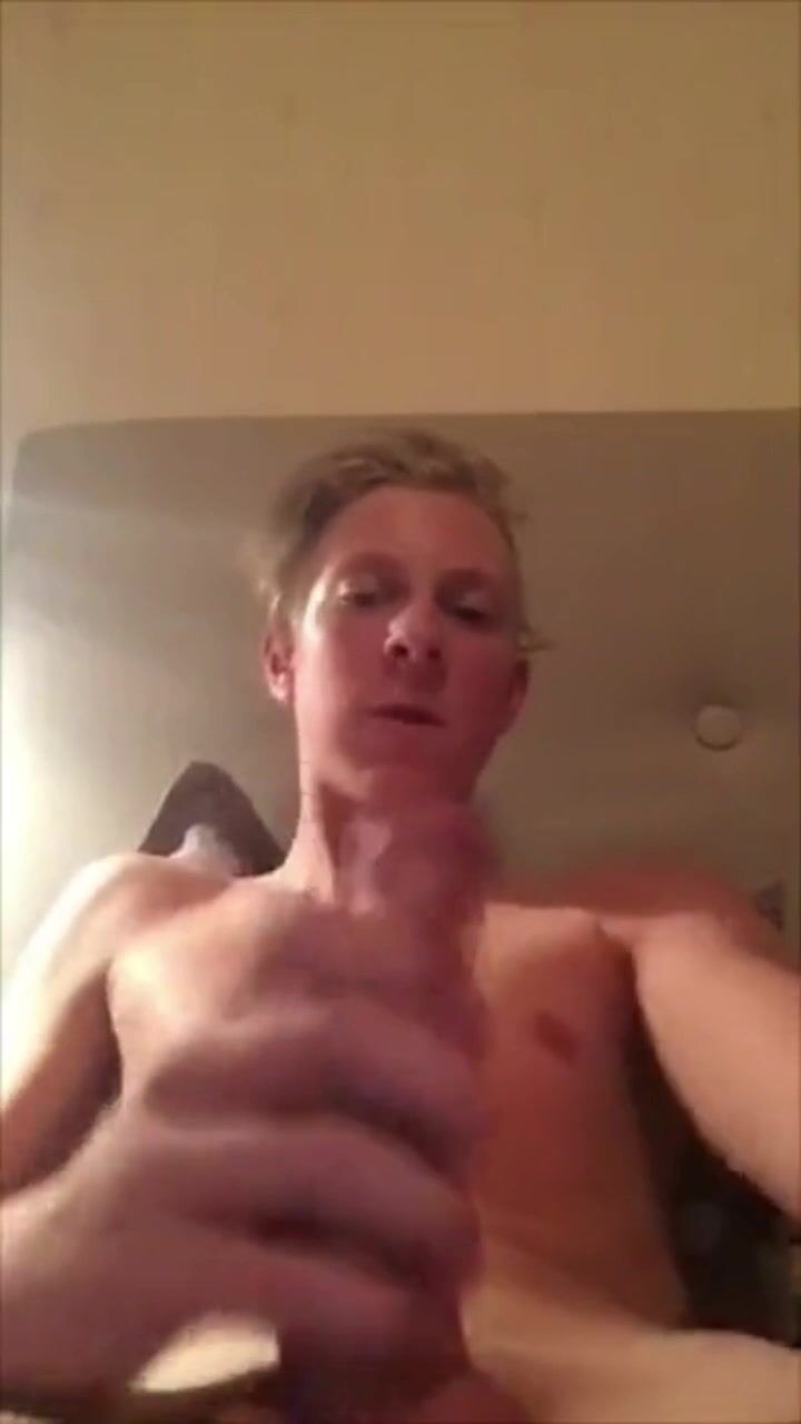 Sexy blond hunk strokes his hard cock