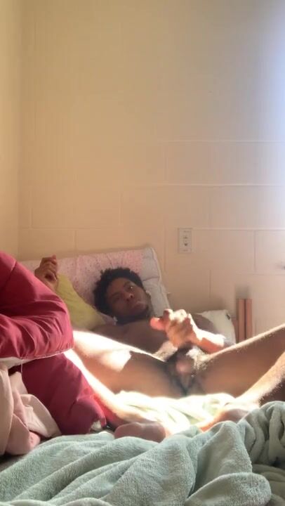 Black college stud jerks his cock and plays with hole in dorm