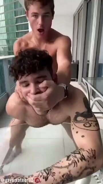 Balcony bareback: twink takes daddy's cock