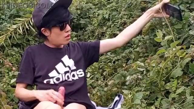 White socks twink strokes cock in woods