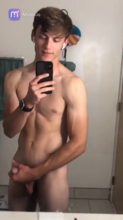 Handsome guy jerks off in mirror for lucky viewer