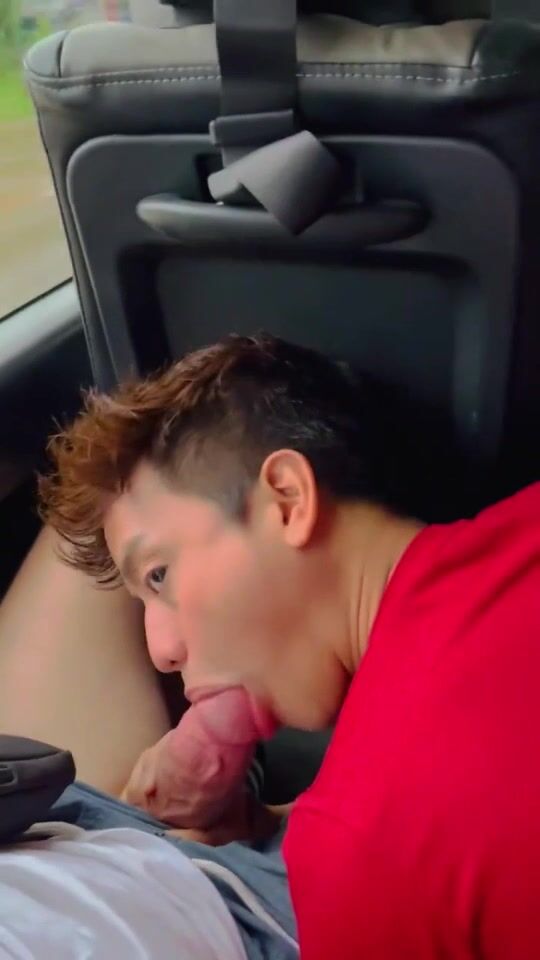 Asian boy sucks a big cock in the car