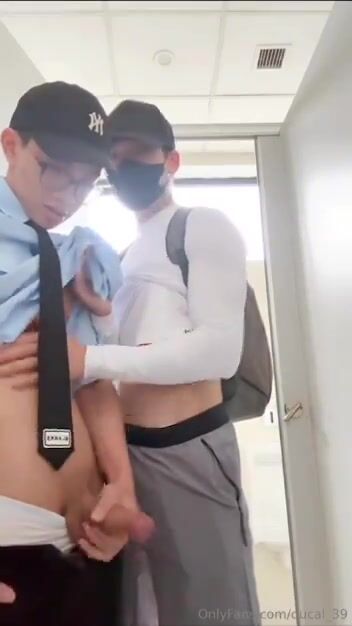 Asian boys have public bathroom fun