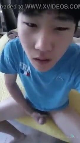 Blue-clad asian teen strokes cock