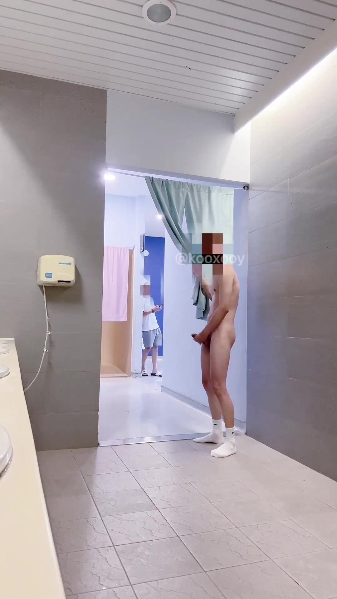 Asian twink strokes cock outside