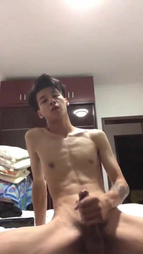 Asian twink strokes hard cock