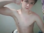 Attractive young boy masturbating on her bed