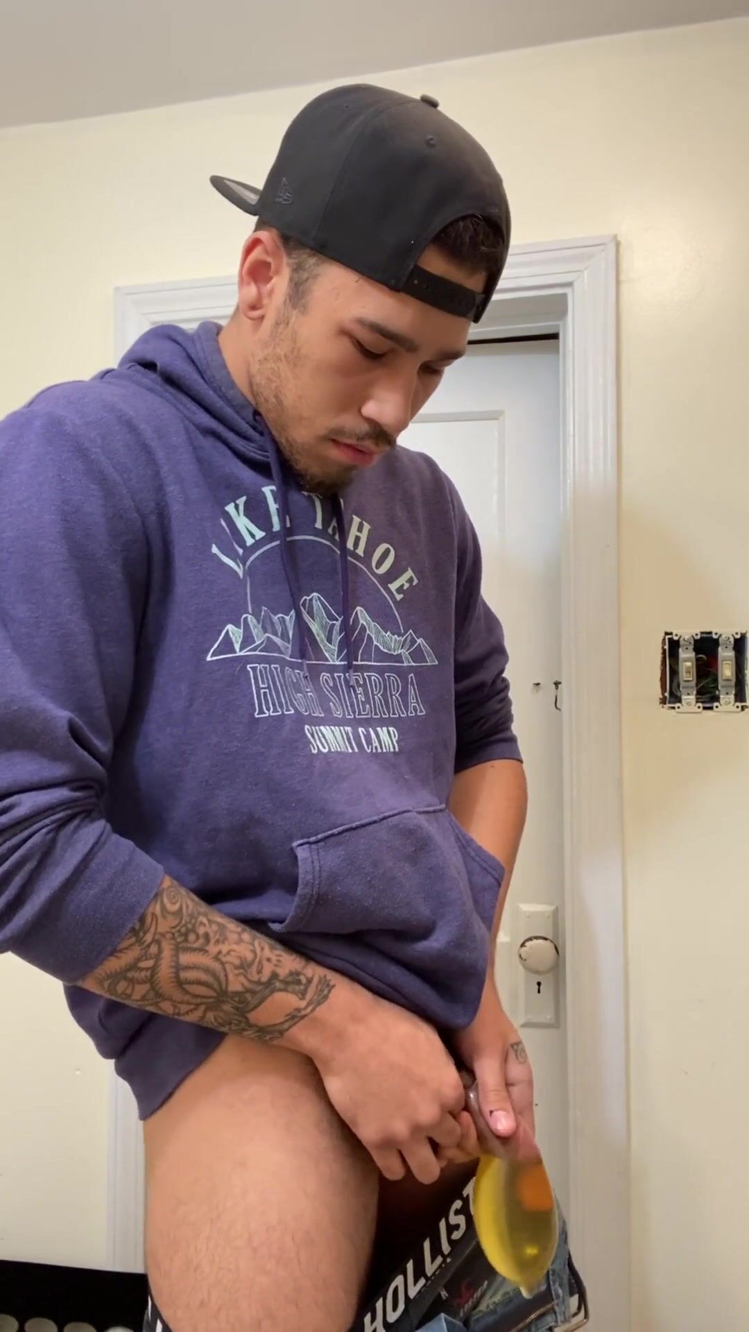 Fit black lad fills condom with piss