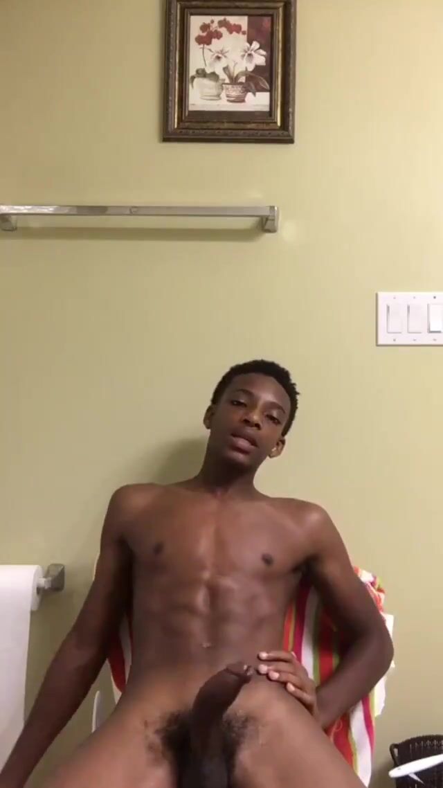 Black muscle boy wanks, shows tongue and pit