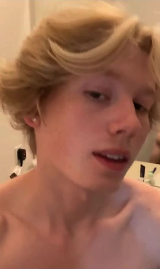 Blond guy jerks off in front of the mirror