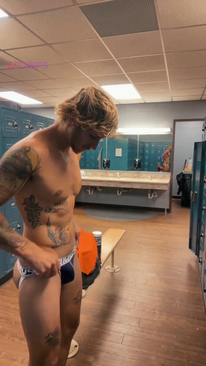 Blond jock caught changing in gym locker room (no sound)