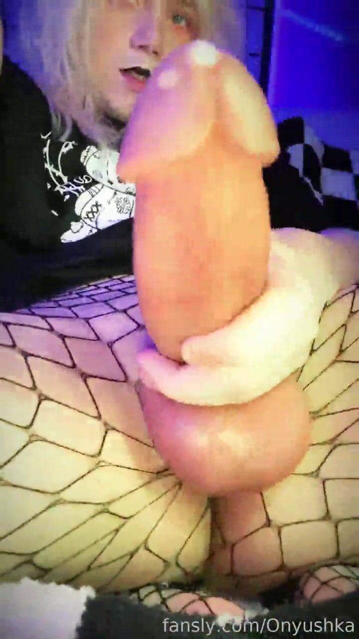 Blond long-haired femboy strokes his cock