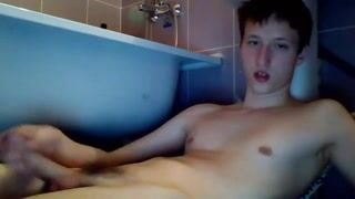 Boy masturbates on side of his bath