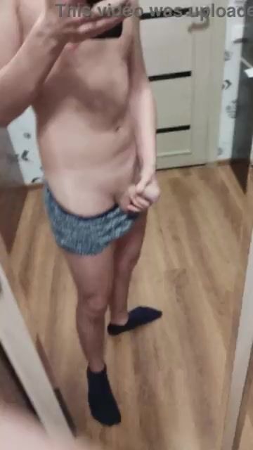 Boy wanks in front of mirror