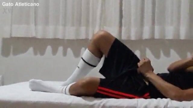 Soccer shorts wank with socks on boy