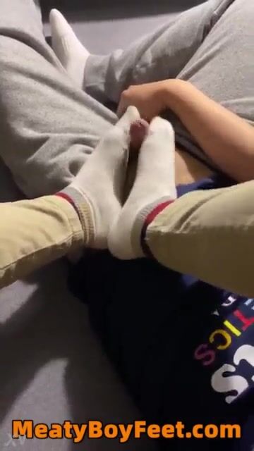 Boys cock gets hard with mates feet in sox