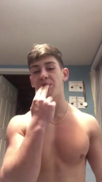 Brunette muscle boy shows how to blow
