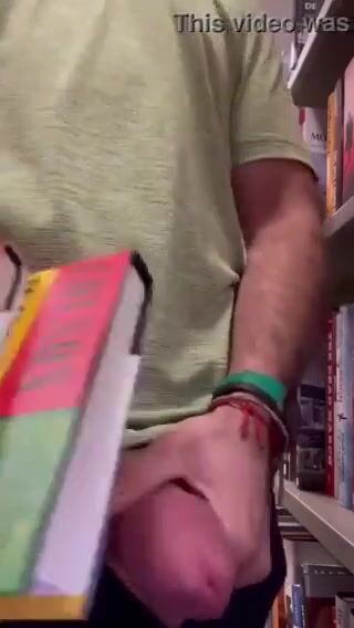 College boy with a thick cock beats off in the library on campus