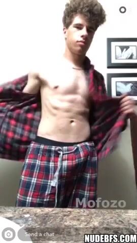 Curly-haired jock flaunts bushy hung cock