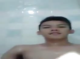 Cute asian boy naughty in shower