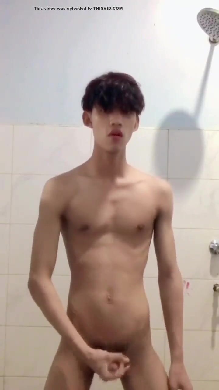 Asian twink strokes his cock until he cums
