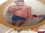 Cute boy in front his mirror
