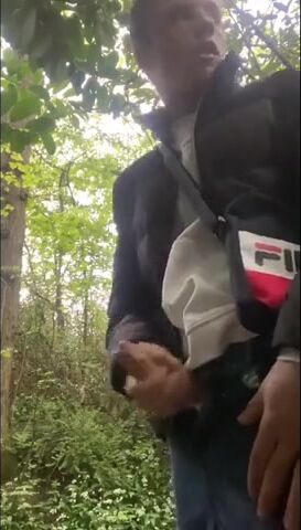 Cute guy strokes cock outside