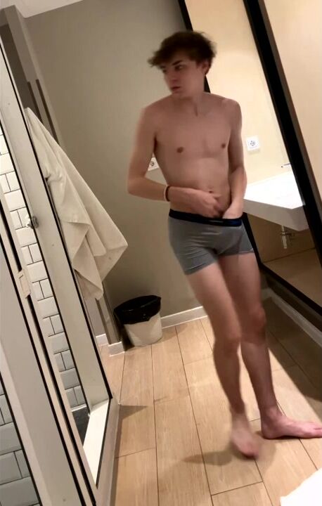 Cute twink getting naked for shower