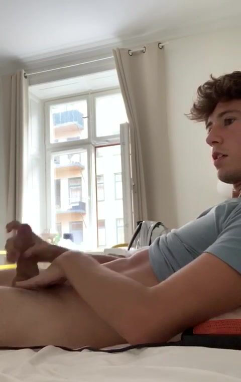 Teen twink wanks hard cock in bed