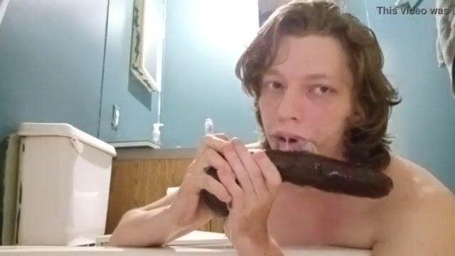 Deepthroating a huge dildo
