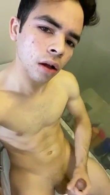 Solo twink wanks his hard cock at home