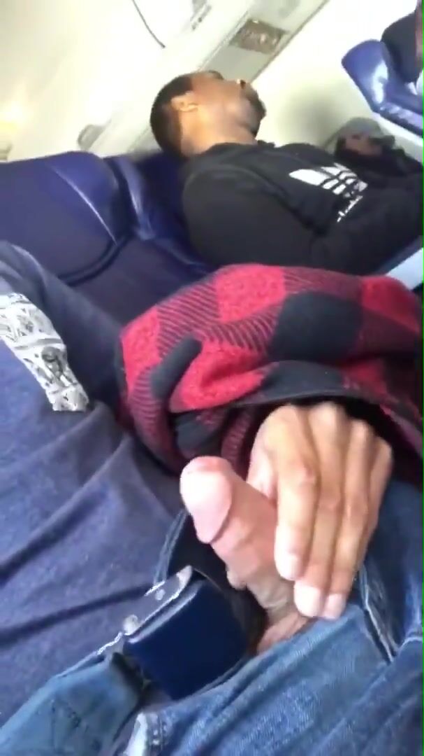 Packed airplane jerk off: dude unloads his cock mid-flight