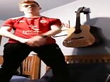 Fire crotch twink strips and plays guitar