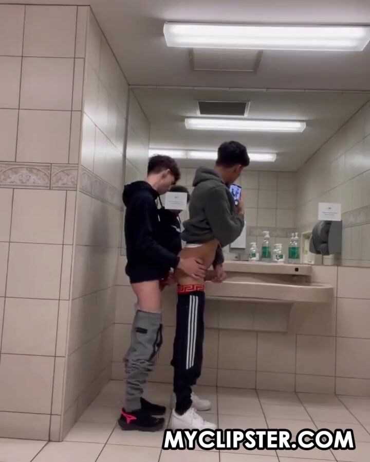 Fucking bareback in a public toilet