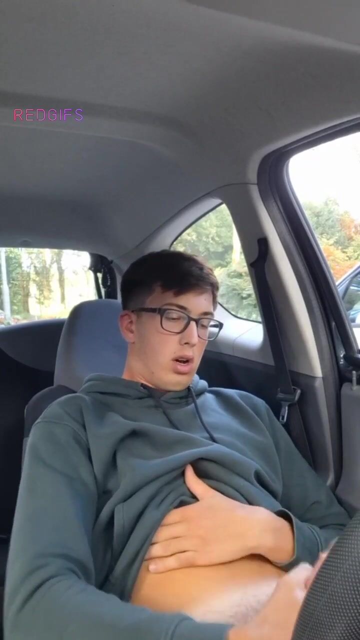 Geek jerks hard cock in car