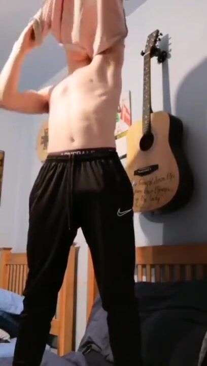 Ginger twink slowly reveals tight ass