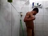 Gorgeous boy filming while he was washing up