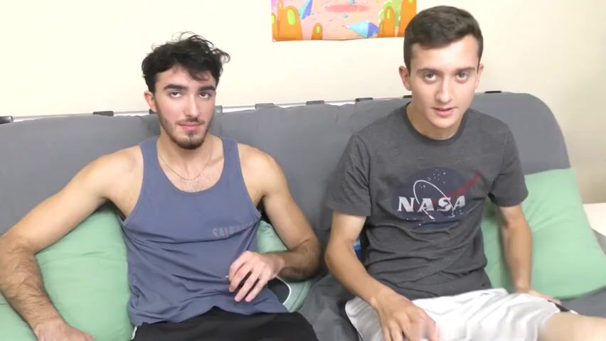 Bareback boys fuck on gray futon