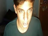 Green eyed boy shows off