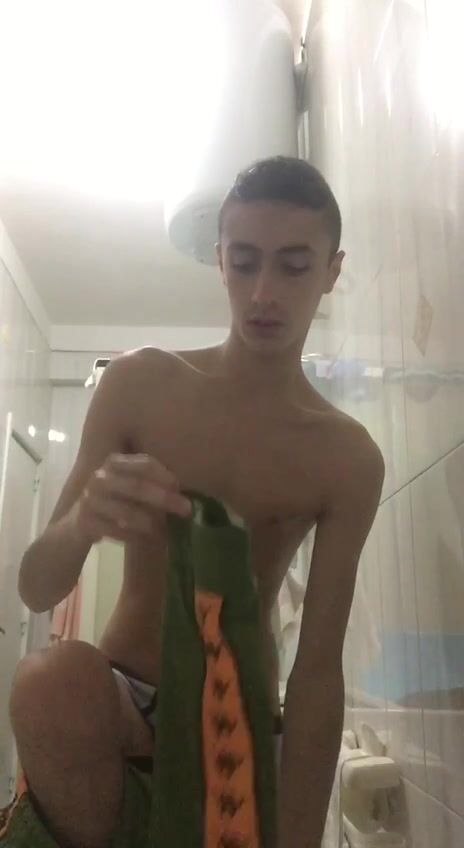 Green tracksuit boy strips naked