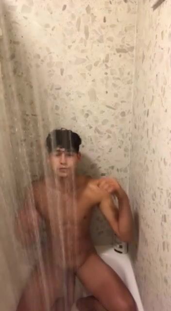 Latino twink chews gum and sits in shower