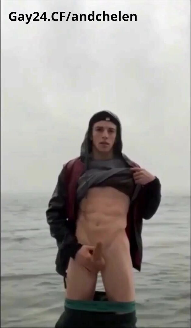 Guy jerks off public on the beach in the sea